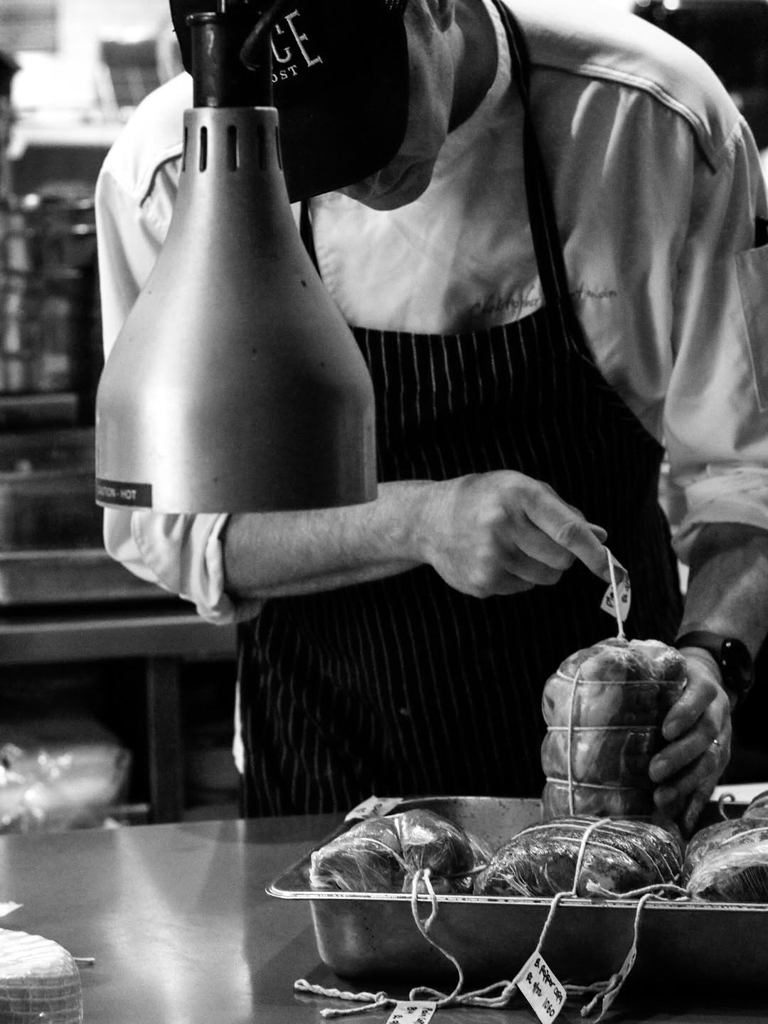 Chef Chris preparing food in the Fence & Post kitchen