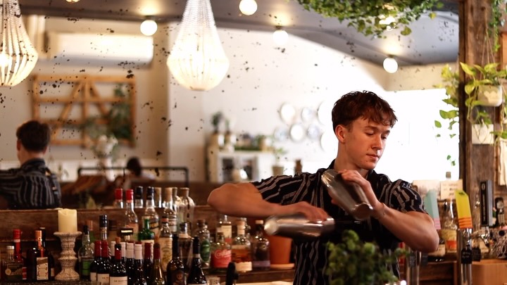 Bartender pouring cocktails at Fence & Post
